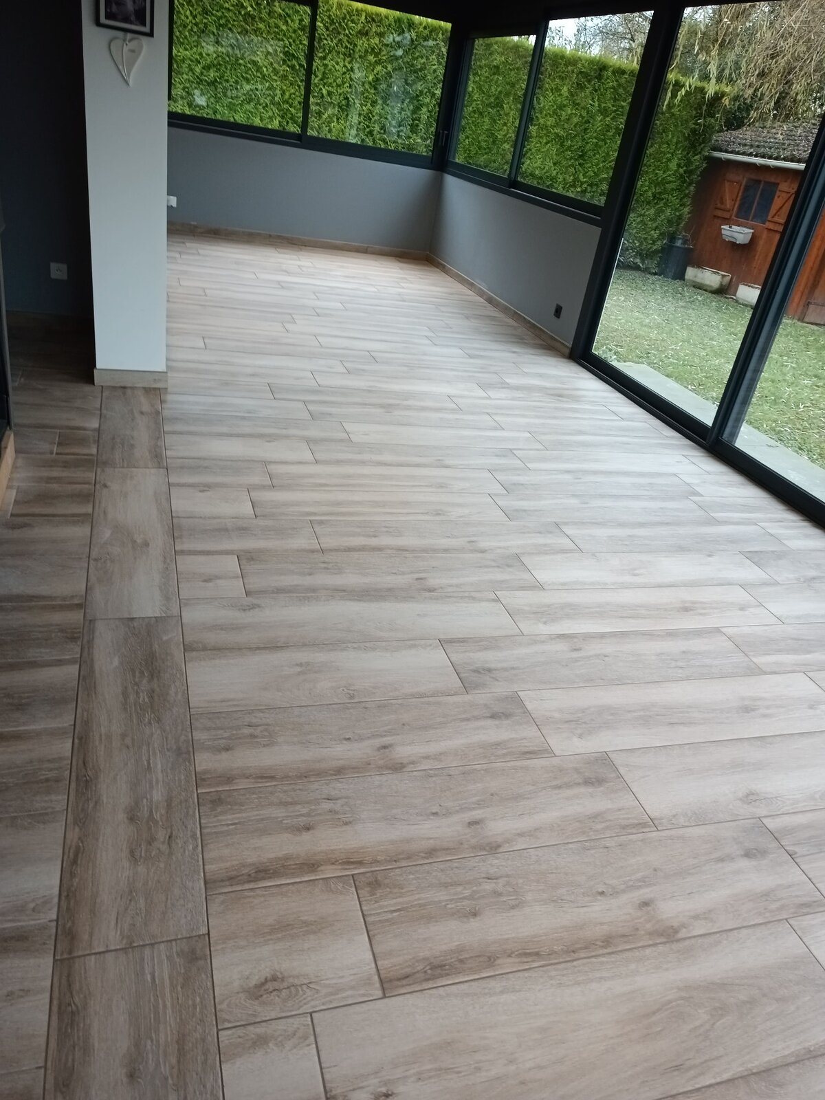 Pose de carrelage — intérieur : Véranda carrelage effet bois